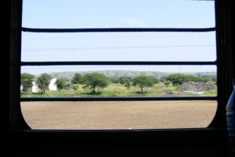 Window view of the countryside from train